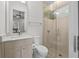 Modern bathroom featuring a glass enclosed shower, tiled walls, and a ceiling fan at 1820 Englewood Rd, Winter Park, FL 32789