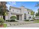 Striking two-story modern home featuring a stone accent wall and professionally landscaped front yard at 1820 Englewood Rd, Winter Park, FL 32789