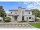 Striking two-story modern home featuring a stone accent wall and professionally landscaped front yard at 1820 Englewood Rd, Winter Park, FL 32789