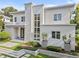 Contemporary home with a stone accent wall, manicured landscaping, and a grand entrance at 1820 Englewood Rd, Winter Park, FL 32789