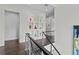 Hallway featuring display niche with glass vases and modern railing at 1820 Englewood Rd, Winter Park, FL 32789