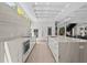 Spacious kitchen with an eat-in island, marble countertops, and high-end stainless steel appliances at 1820 Englewood Rd, Winter Park, FL 32789