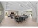 Open-concept living area with dining space, fireplace, and a modern kitchen with eat-in island at 1820 Englewood Rd, Winter Park, FL 32789