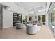 Bright living room with high ceilings, glass doors, and stylish contemporary furniture at 1820 Englewood Rd, Winter Park, FL 32789