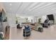 Modern living space with sleek furniture, contemporary decor, and kitchen with eat-in island at 1820 Englewood Rd, Winter Park, FL 32789