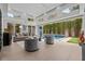 Bright open living room with floor-to-ceiling windows and seamless access to the backyard pool at 1820 Englewood Rd, Winter Park, FL 32789
