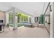 Indoor-outdoor living space with a seating area and view of the pool at 1820 Englewood Rd, Winter Park, FL 32789