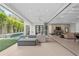 Open floor plan with a seating area leading to a lanai and outdoor pool at 1820 Englewood Rd, Winter Park, FL 32789