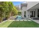 Modern backyard pool featuring clean lines, lush landscaping, and privacy at 1820 Englewood Rd, Winter Park, FL 32789