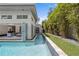 Sleek modern pool with lush bamboo backdrop, perfect for relaxation and privacy at 1820 Englewood Rd, Winter Park, FL 32789