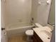 Clean bathroom with a tub and vanity with a single sink at 2018 Cypress Bay Blvd, Kissimmee, FL 34743