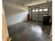 Spacious one car garage interior with cinder block wall at 2018 Cypress Bay Blvd, Kissimmee, FL 34743