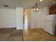 View of the kitchen with white appliances and view of the entry at 2018 Cypress Bay Blvd, Kissimmee, FL 34743