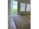 Living room with an open door to the backyard patio at 2018 Cypress Bay Blvd, Kissimmee, FL 34743