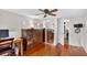 Bedroom with wood floors, closet with mirrored doors, and access to laundry area at 2021 University Dr, Orlando, FL 32804