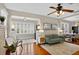 Comfortable living room with hardwood floors, large windows, and an open design creating a welcoming atmosphere at 2021 University Dr, Orlando, FL 32804
