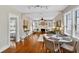 Living room boasts hardwood floors, modern lighting, and leads to the bedroom and kitchen at 2021 University Dr, Orlando, FL 32804