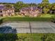 Aerial view showing tennis court and surrounding condo buildings at 209 Villa Di Este Ter # 205, Lake Mary, FL 32746