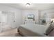 Bedroom with white walls, contemporary decor, and ample natural light at 209 Villa Di Este Ter # 205, Lake Mary, FL 32746