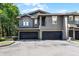 Two-story townhouse with a two-car garage and neutral exterior paint at 209 Villa Di Este Ter # 205, Lake Mary, FL 32746