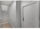 Entryway featuring a staircase and a white door at 209 Villa Di Este Ter # 205, Lake Mary, FL 32746