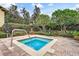 Private hot tub area surrounded by lush landscaping, creating a serene escape at 209 Villa Di Este Ter # 205, Lake Mary, FL 32746