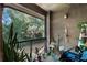 Cozy patio filled with lush plants, offering a relaxing outdoor space at 209 Villa Di Este Ter # 205, Lake Mary, FL 32746