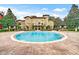 Resort-style swimming pool and amenity center with inviting lounge areas, perfect for relaxation at 209 Villa Di Este Ter # 205, Lake Mary, FL 32746