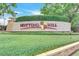 Elegant stone and hedge sign for Notting Hill community at 209 Villa Di Este Ter # 205, Lake Mary, FL 32746