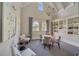 Bright, airy sitting room with bookshelves and decorative accents, perfect for relaxing at 209 Villa Di Este Ter # 205, Lake Mary, FL 32746