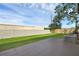 The backyard has a concrete patio and grassy area with a privacy fence and mature tree at 2120 Windsor Lake Cir, Sanford, FL 32773
