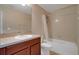 Clean bathroom with cherry vanity and a shower-tub combination at 2120 Windsor Lake Cir, Sanford, FL 32773