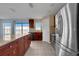 Open kitchen boasts stainless appliances, tile floors, island with bar seating, and ample counter space at 2120 Windsor Lake Cir, Sanford, FL 32773