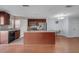 Spacious kitchen with a central island, stainless steel appliances, and hardwood flooring at 2120 Windsor Lake Cir, Sanford, FL 32773