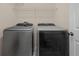 Bright laundry room with modern, front-loading washer and dryer at 2120 Windsor Lake Cir, Sanford, FL 32773