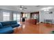 Open-concept living space with hardwood floors, stainless appliances, and access to the backyard at 2120 Windsor Lake Cir, Sanford, FL 32773