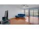 Bright living room with hardwood flooring, modern furnishings, and lots of natural light at 2120 Windsor Lake Cir, Sanford, FL 32773
