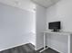 Upstairs room for office use with light blue walls and black monitor on white desk at 2120 Windsor Lake Cir, Sanford, FL 32773
