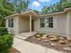 Inviting single-story home with a covered entry and manicured landscaping at 2193 County Road 204, Oxford, FL 34484