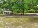 Charming property with a circular driveway and well-maintained landscaping, offering a welcoming curb appeal at 2193 County Road 204, Oxford, FL 34484