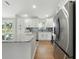 Bright, modern kitchen featuring stainless steel appliances and a granite-topped island at 2193 County Road 204, Oxford, FL 34484