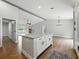 Stylish kitchen island with granite countertops, modern lighting, and convenient seating at 2193 County Road 204, Oxford, FL 34484