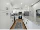 Contemporary kitchen with stainless steel appliances, granite countertops, and ample cabinet space at 2193 County Road 204, Oxford, FL 34484