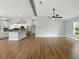 Bright, open floor plan with wood floors, eat-in kitchen, and vaulted ceiling at 2193 County Road 204, Oxford, FL 34484