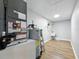 Well-lit utility room with water heater, shelving, and a sink at 2193 County Road 204, Oxford, FL 34484
