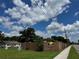 Exterior shows a Mum Bedroom with a long fence and greenery next to a sidewalk at 2223 Kilmer Ln, Apopka, FL 32703
