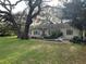 Charming single-story home with a spacious yard and mature trees providing ample shade at 2223 Kilmer Ln, Apopka, FL 32703