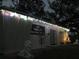 Night exterior view of meditation center with seasonal decorations and holiday lights at 2223 Kilmer Ln, Apopka, FL 32703