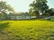 Spacious front yard with mature trees offering a serene view at 2223 Kilmer Ln, Apopka, FL 32703