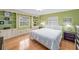 Cozy bedroom featuring built-in shelving and cabinets, with hardwood floors and neutral decor at 2500 Lake Shore Dr, Orlando, FL 32803